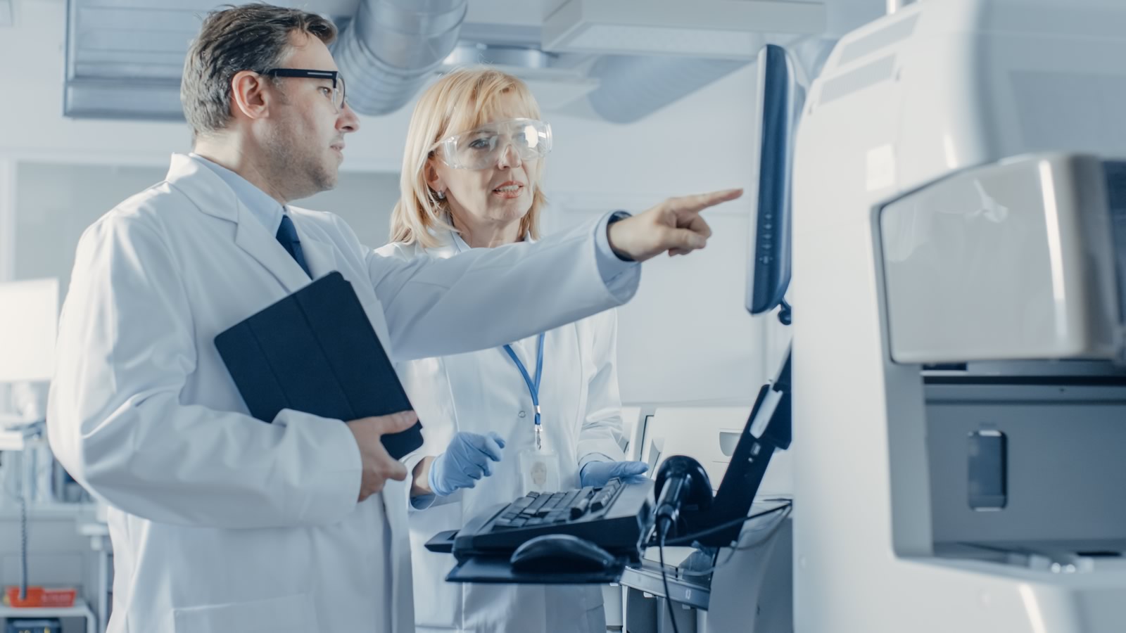 Scientists viewing a computer screen