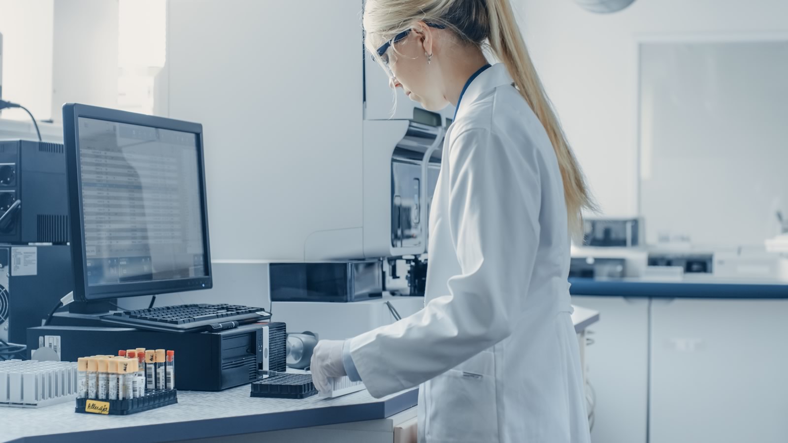 Scientist using computer in lab