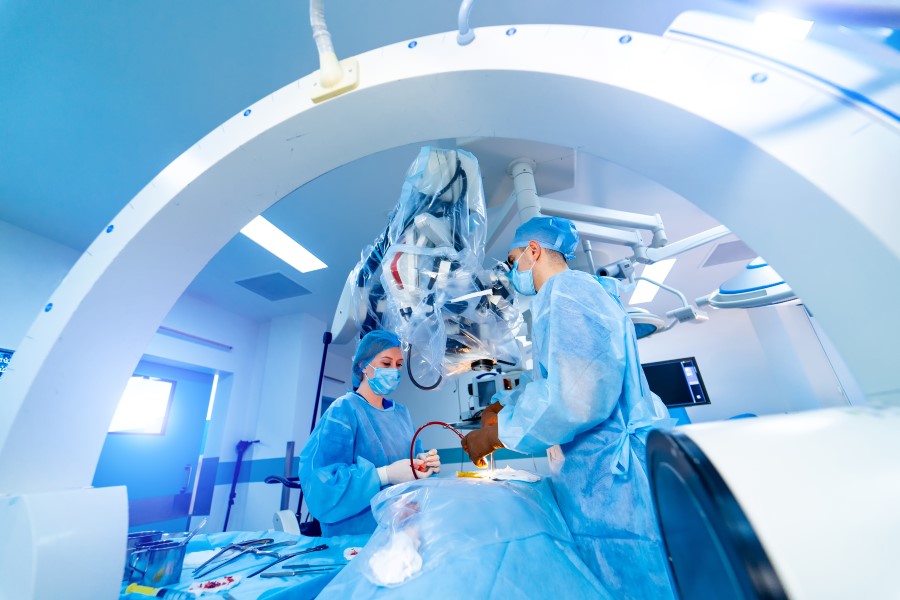 Surgeons performing an operation with advanced medical devices