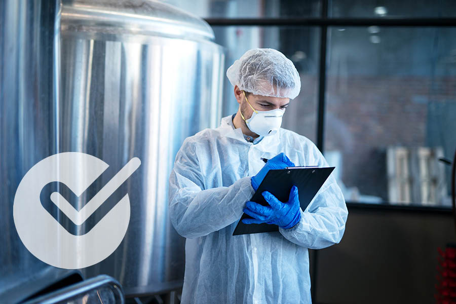 Man holding a a tablet with a check indicating VALIDATION